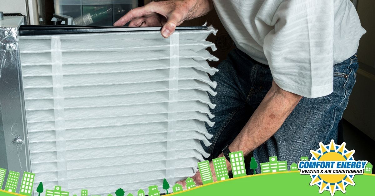 Man replaces air filter